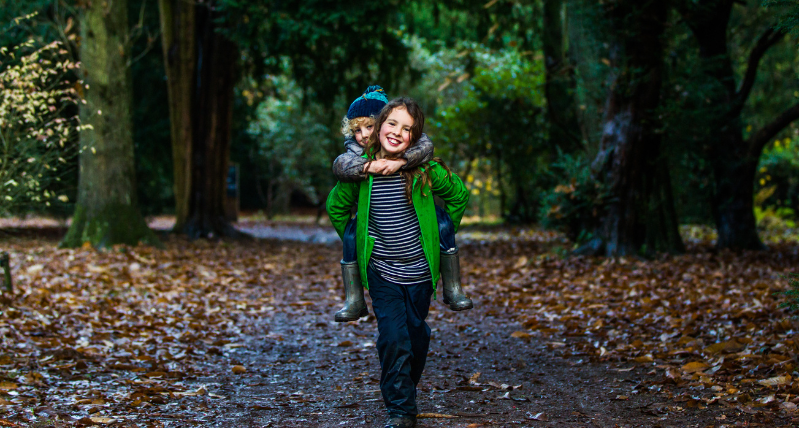 Girl and Boy walking through Westonbirt Arboretum credit Johnny Hathaway